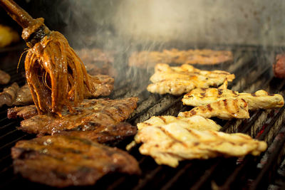 Close-up of meat on barbecue grill