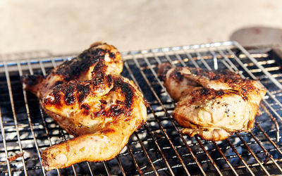 Close-up of chicken meat on barbecue grill