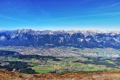 Scenic view of landscape against blue sky