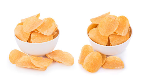 High angle view of bread in bowl against white background