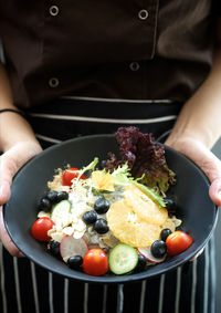 Close-up of cropped hand holding food