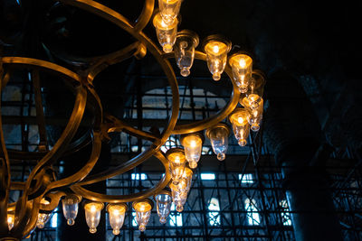 Low angle view of illuminated building at night