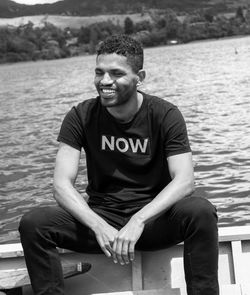 Portrait of young man sitting outdoors