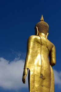 Low angle view of statue against blue sky