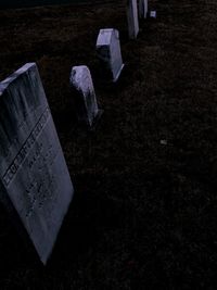 High angle view of text on cemetery at night