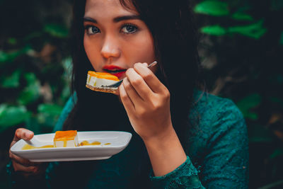 Woman having dessert at table