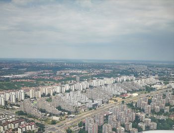 Aerial view of cityscape against sky