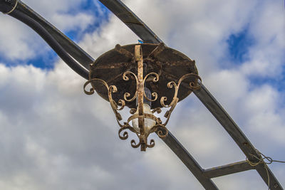 Low angle view of hanging against sky