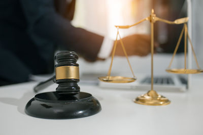 Close-up of hand holding candles on table