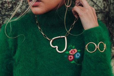 Close-up of woman holding plant