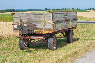 Tractor on agricultural field against sky