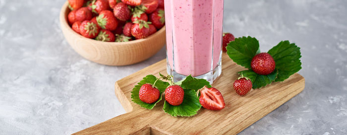 High angle view of strawberries in basket on table