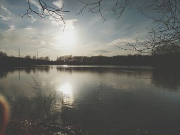 Scenic view of lake against sky during sunset