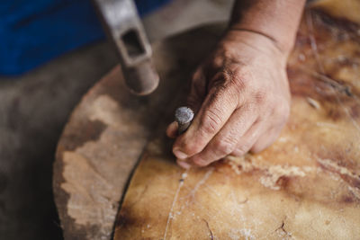 Cropped hand of person preparing food