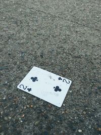 High angle view of arrow sign on road