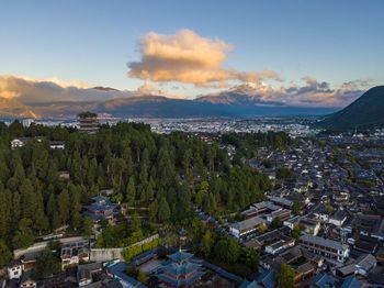 Aerial view of town against sky during sunset