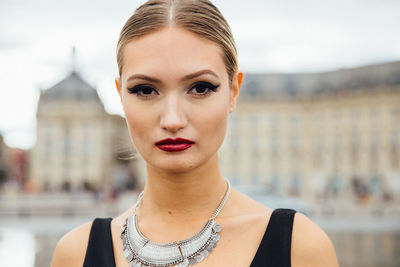 Portrait of beautiful model standing on city street