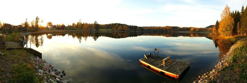 Reflection of trees in calm lake