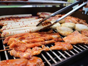 High angle view of meat on barbecue grill