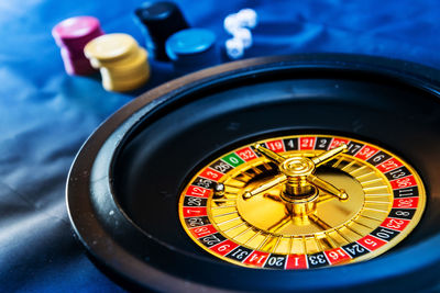 Gambling chips and dice with casino on table