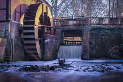 Water wheel by waterfall