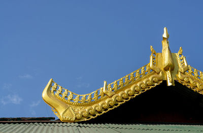 Low angle view of temple against building