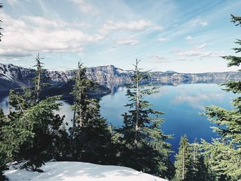 Scenic view of lake and mountains against sky