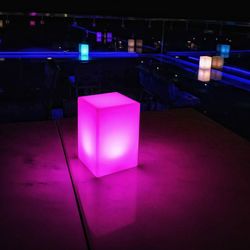 Illuminated light bulbs on table at night