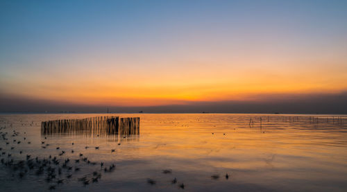 Scenic view of sea against sky during sunset