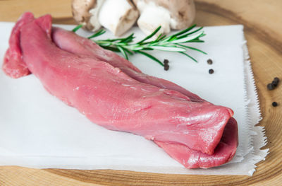 Close-up of meat on cutting board