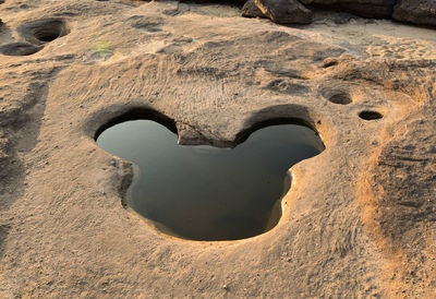 High angle view of hole on rock