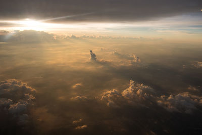 Aerial view of silhouette landscape against sky during sunset