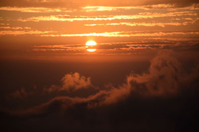 Low angle view of dramatic sky during sunset