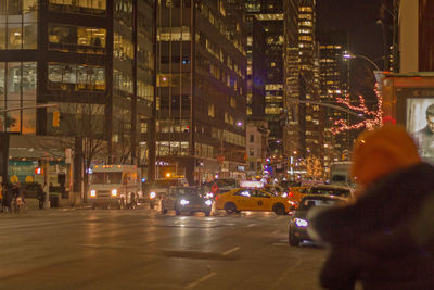 Illuminated city street at night