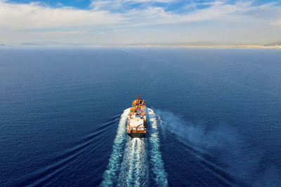 High angle view of boat in sea against sky