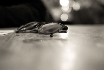 Close-up of wine glasses on table