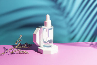 Close-up of beauty products on pink background