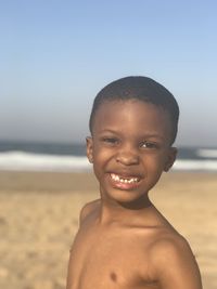 Portrait of smiling boy on beach