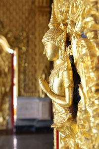 Close-up of statue against temple