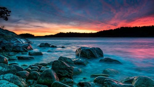 Scenic view of sea against sky during sunset