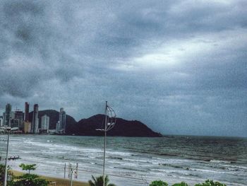 Scenic view of sea against cloudy sky