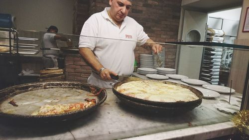 Man preparing food in kitchen