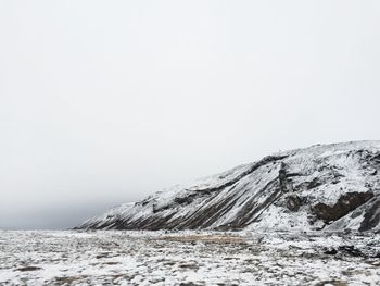 Scenic view of snow covered mountains