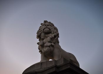 Low angle view of statue against sky