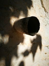 Close-up of hole on brick wall