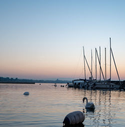 Scenic view of sea against clear sky during sunset