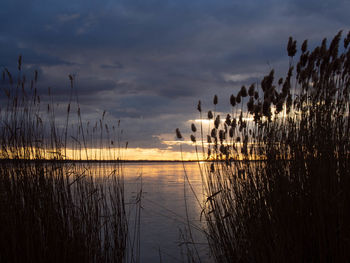 Scenic view of lake against sky during sunset