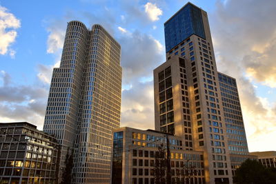 Low angle view of buildings against sky during sunset