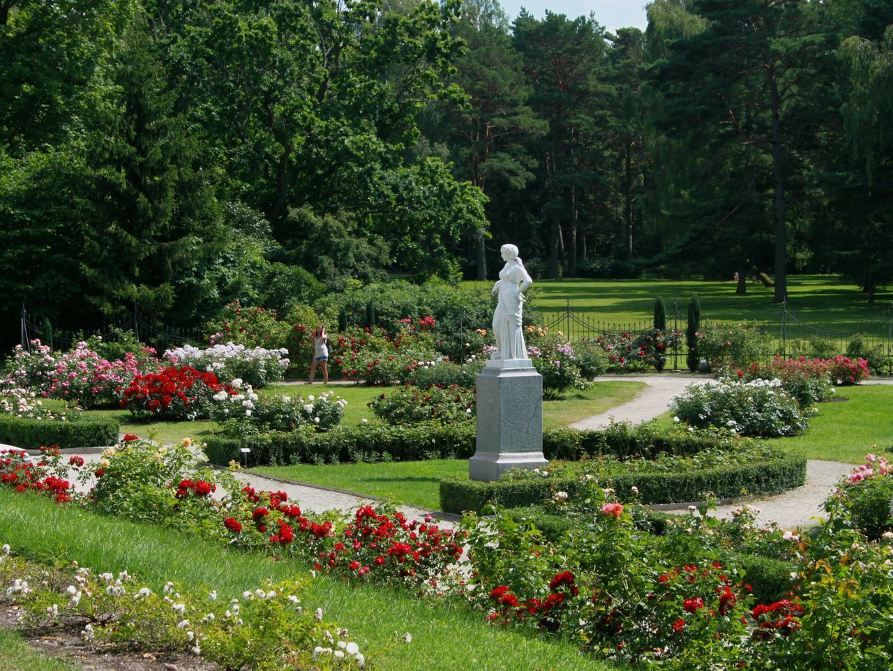 STATUE IN PARK AGAINST TREES