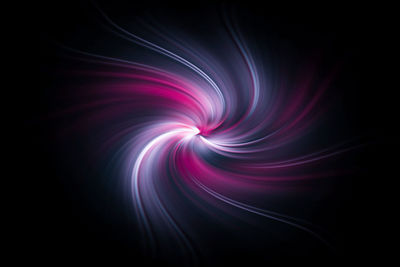 Abstract image of illuminated light against black background